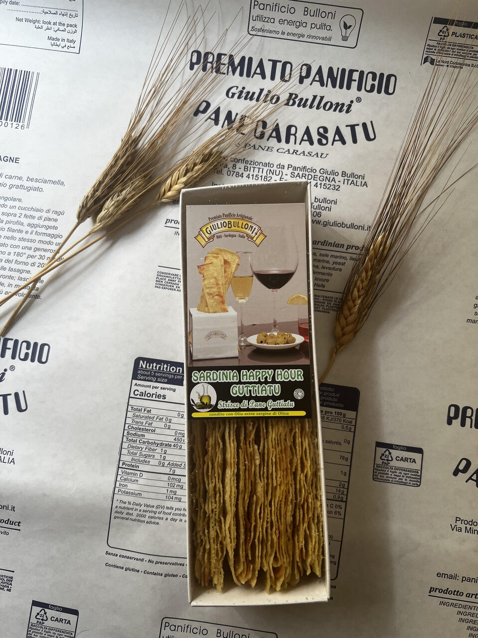 Bread Carasatu Strips– Traditional Thin and crispy, handcrafted in Sardinia following authentic recipes. Available Variants: Guttiau, Guttiatu Herbes, Guttiaatu Pepper   Image