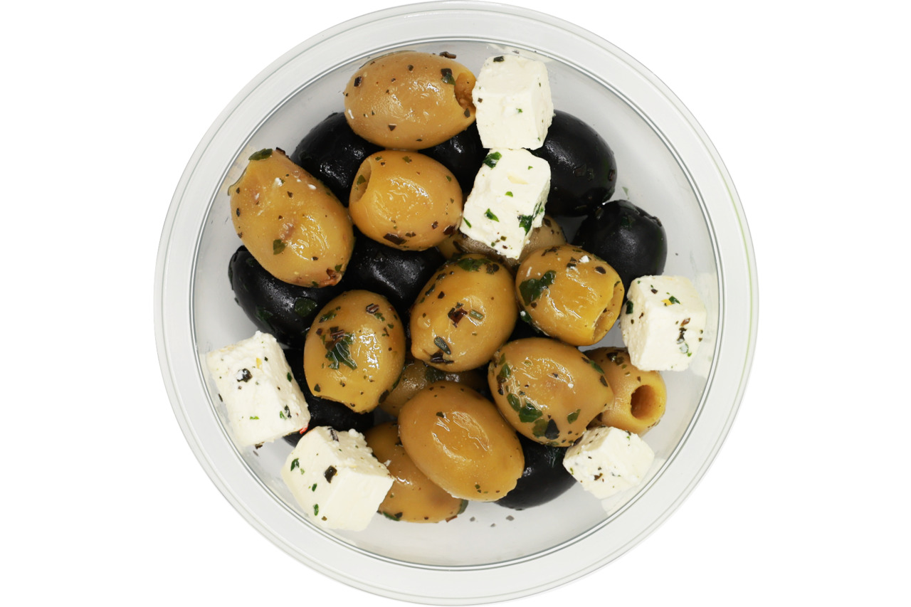 Green and black olives with cheese cubes Image