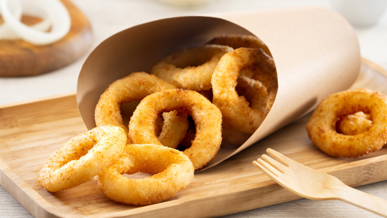 Frozen onion rings and battered vegetables Image