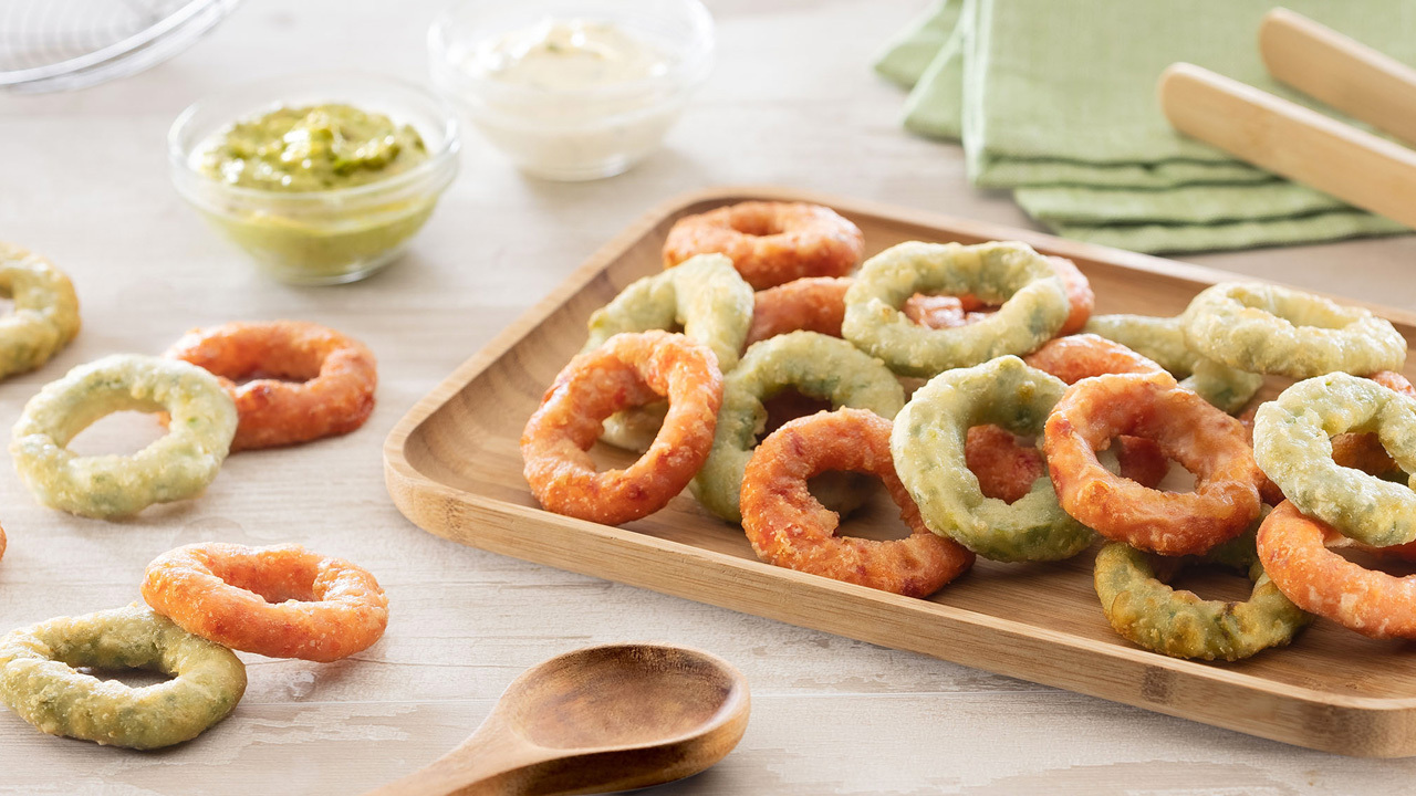 Frozen onion rings and battered vegetables Image