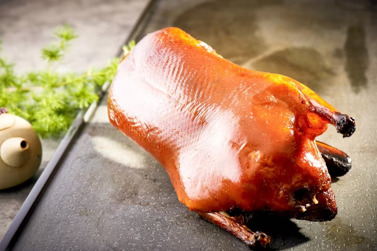 Duck products, such as smoked duck, black pepper duck, Peking duck, duck slices, duck stick skewers, duck spring rolls, etc. Image