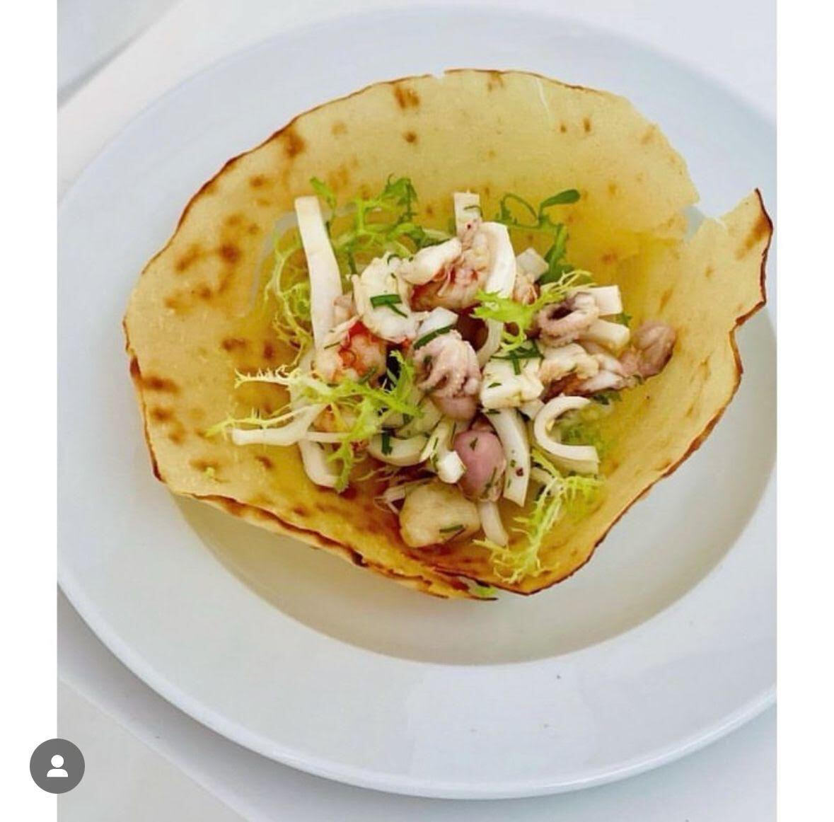 Pane Carasatu – Traditional Thin and crispy, handcrafted in Sardinia following authentic recipes.   Available Variants:  Guttiau seasoned with extra virgin olive oil   Image